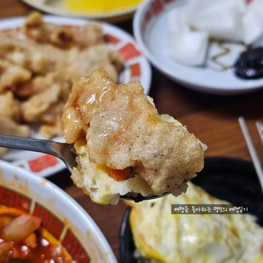 Tangsuyuk piled on top of fried rice