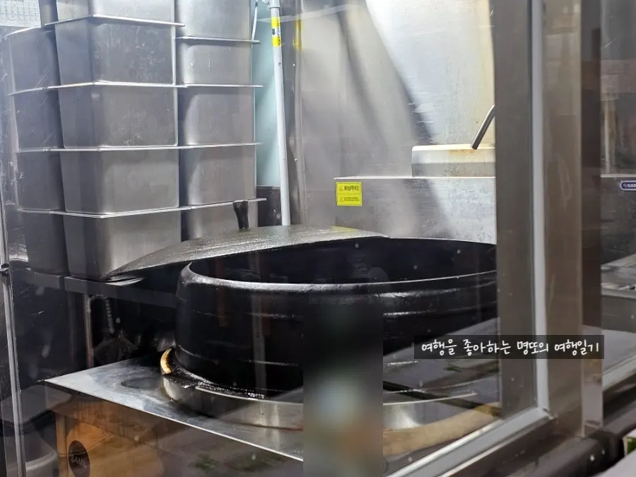 Large cauldron set up to simmer bone broth