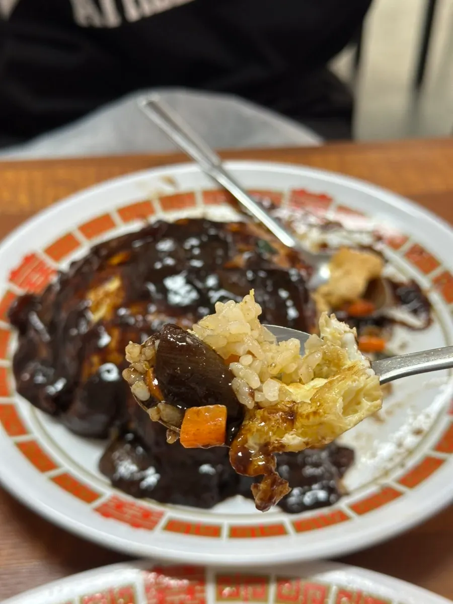 Chinese restaurant style fried rice topped with sauce