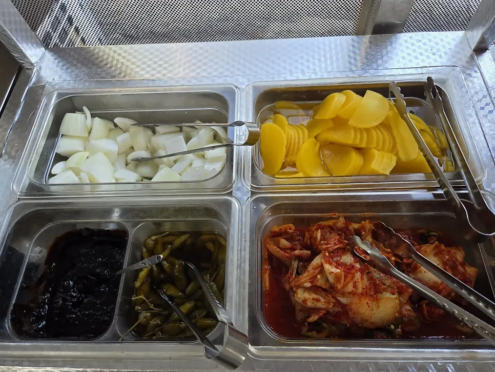 Self-serve water and side dish preparation area at Hwangbihong