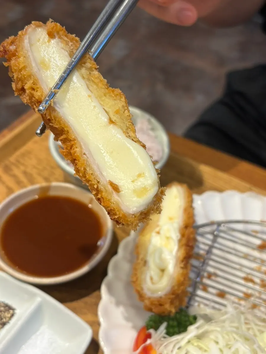 Cross-section of the crispy fried cheese katsu