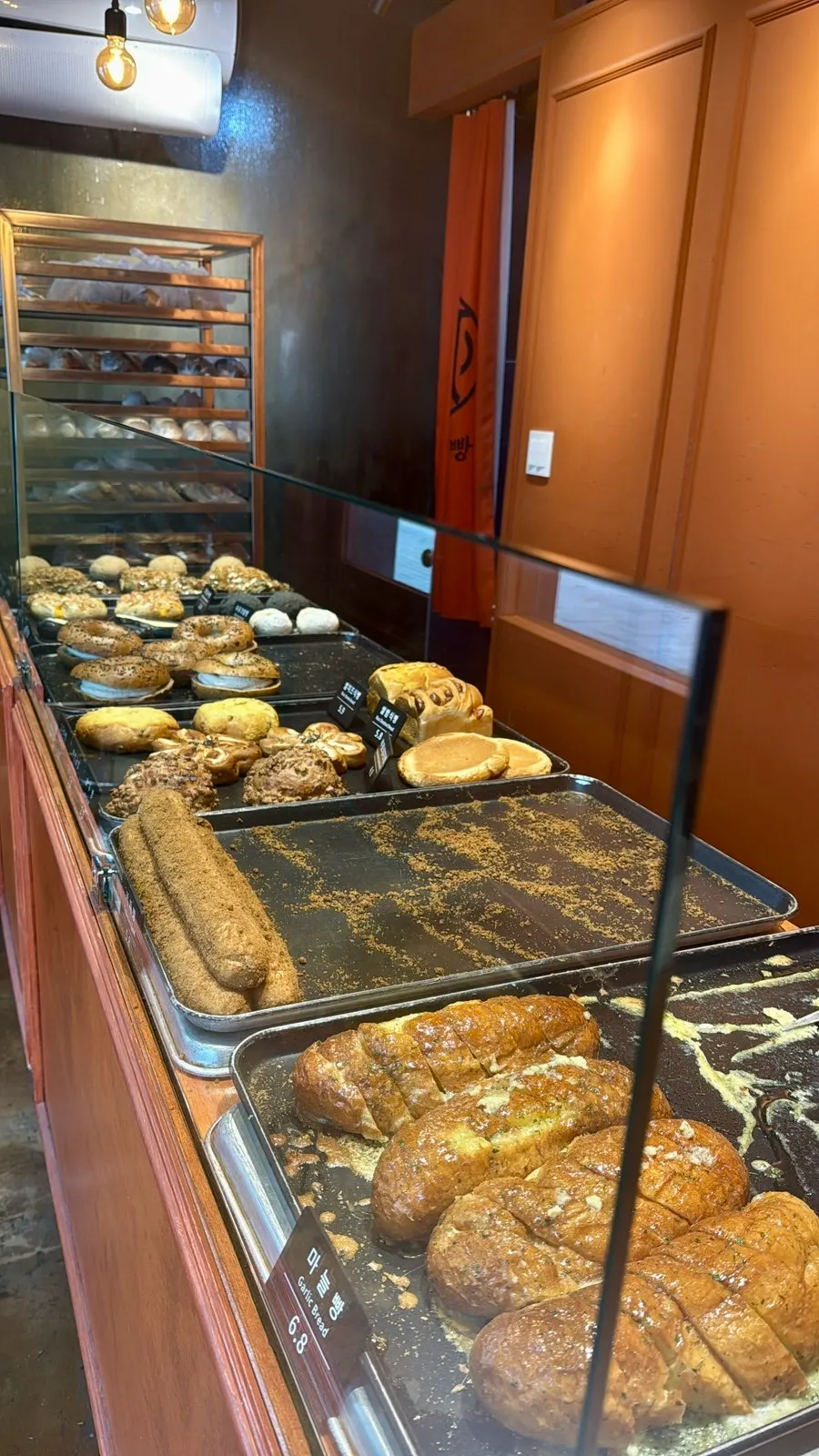 Full view of the bread display case at Munhwa Bakery