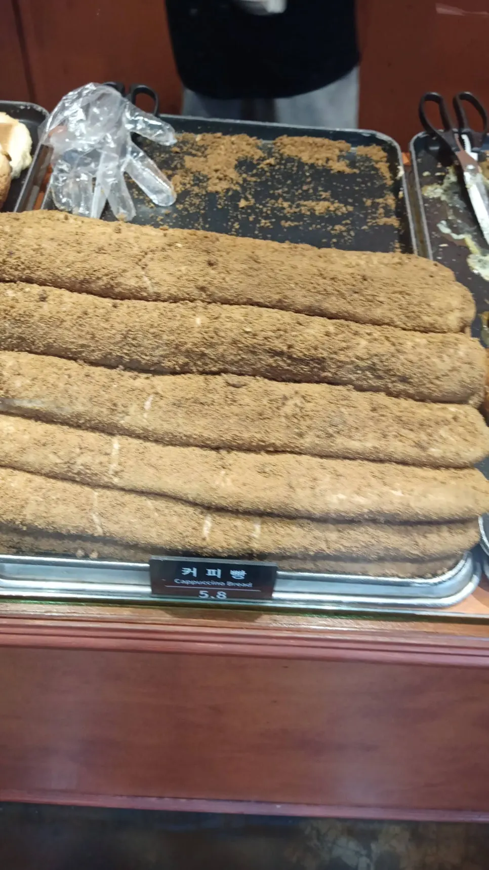 Bread lined up on the shelves at Munhwa Bakery