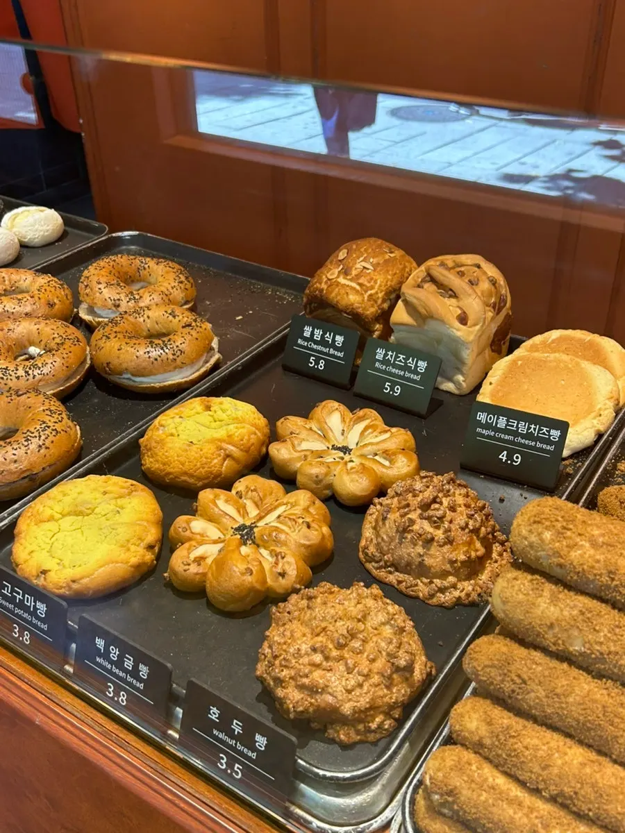 Onion bagels and sweet potato bread on display