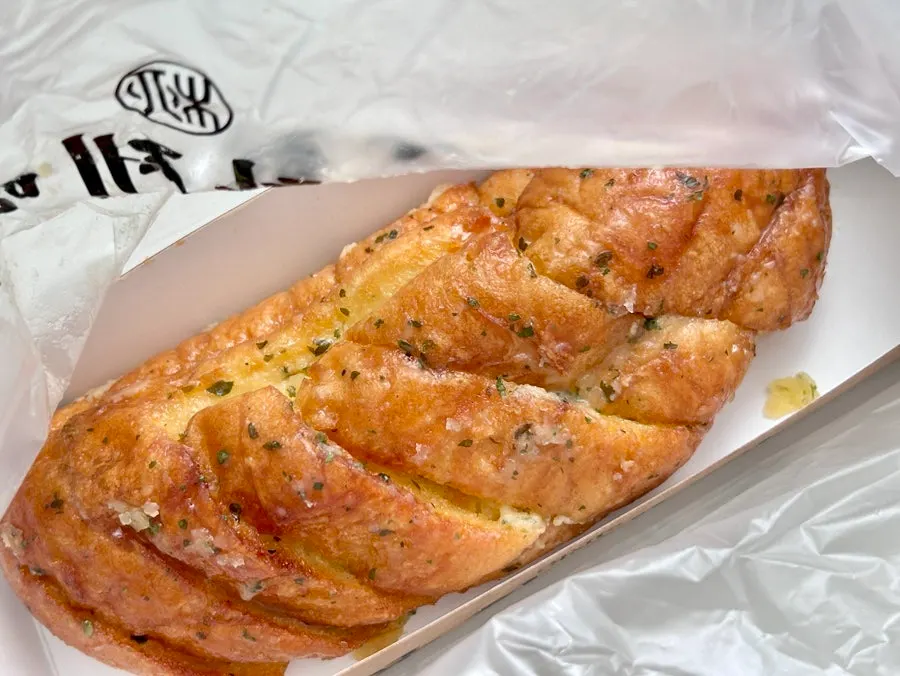 Garlic bread with a moist center and textured exterior