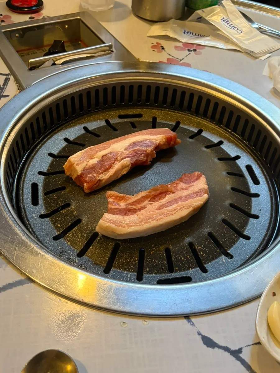 Thick-cut pork placed on the grill