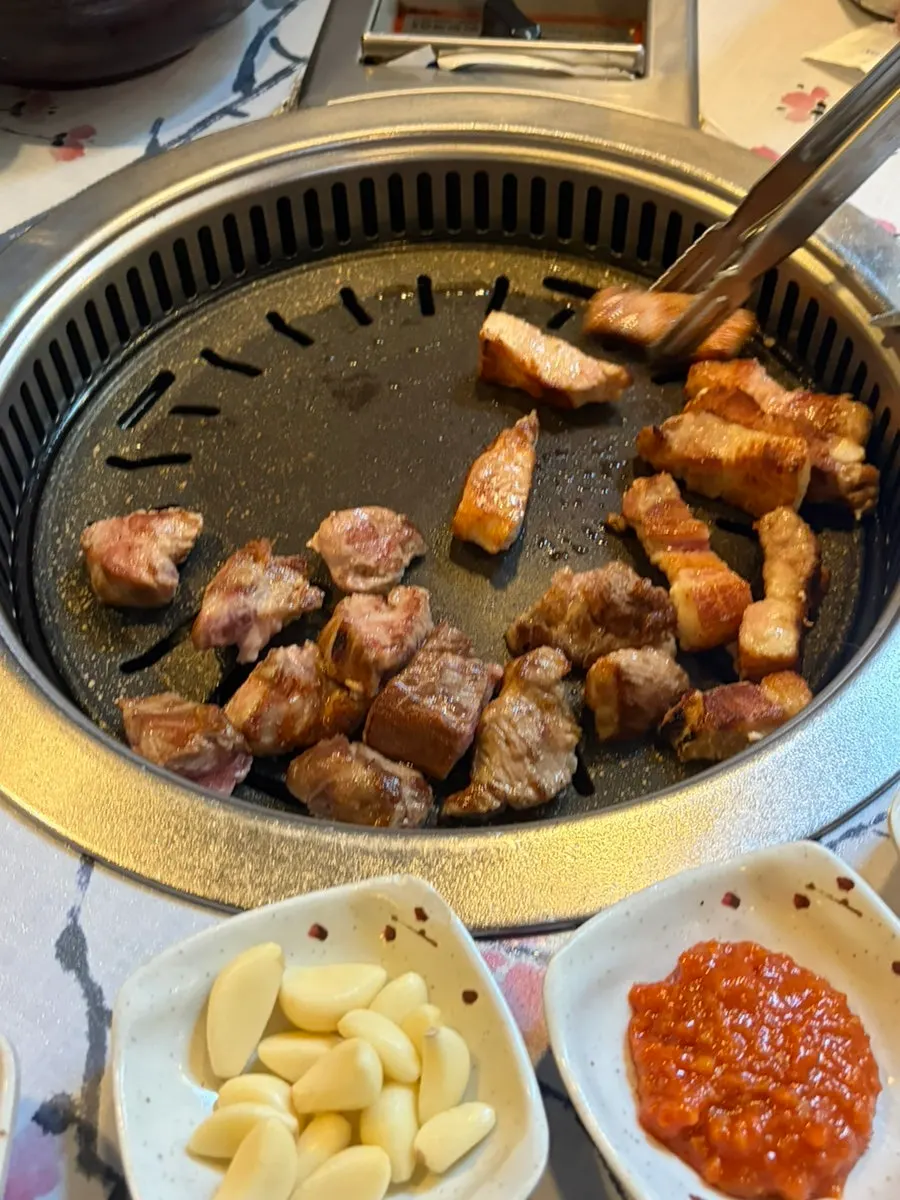 Meongseokjip's pork grilling on the fire