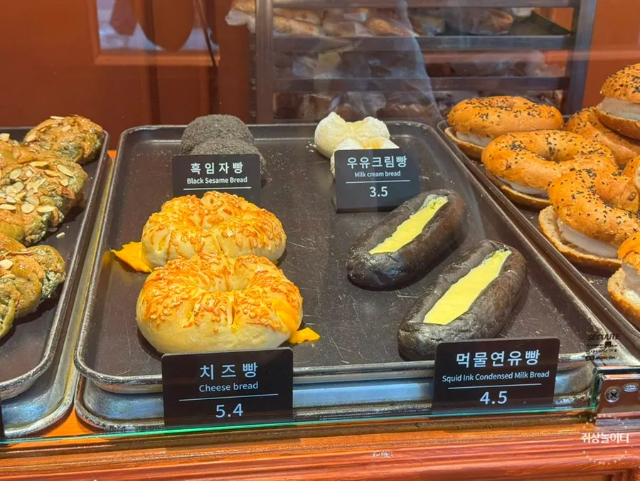 Rice chestnut bread and onion bagels on the display shelf at Munhwa Bakery