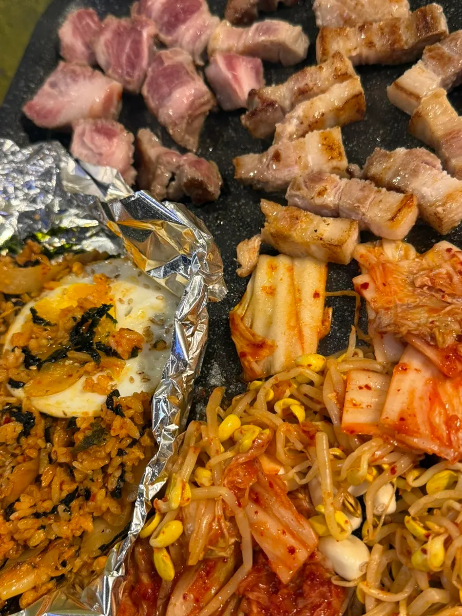 Meat and kimchi grilling on the stone plate