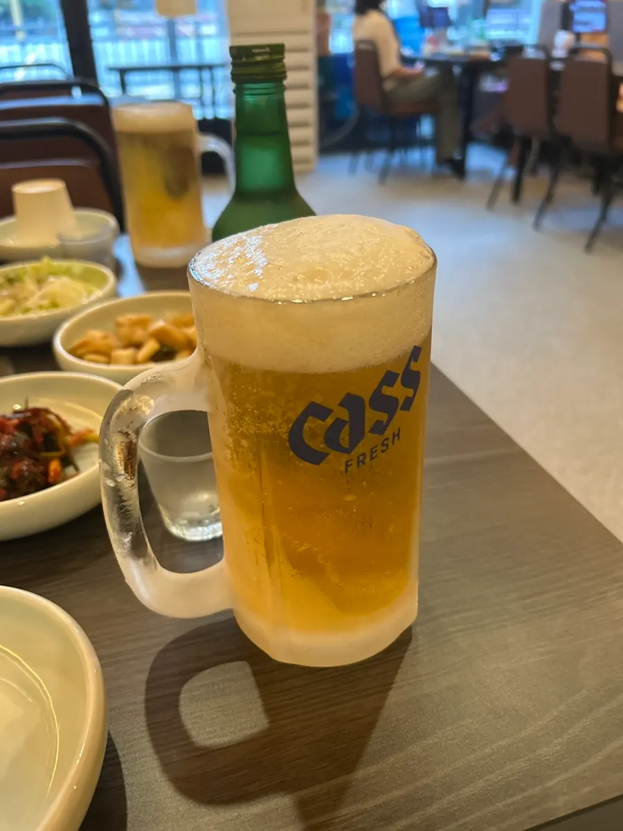 Table with a glass of frosty draft beer