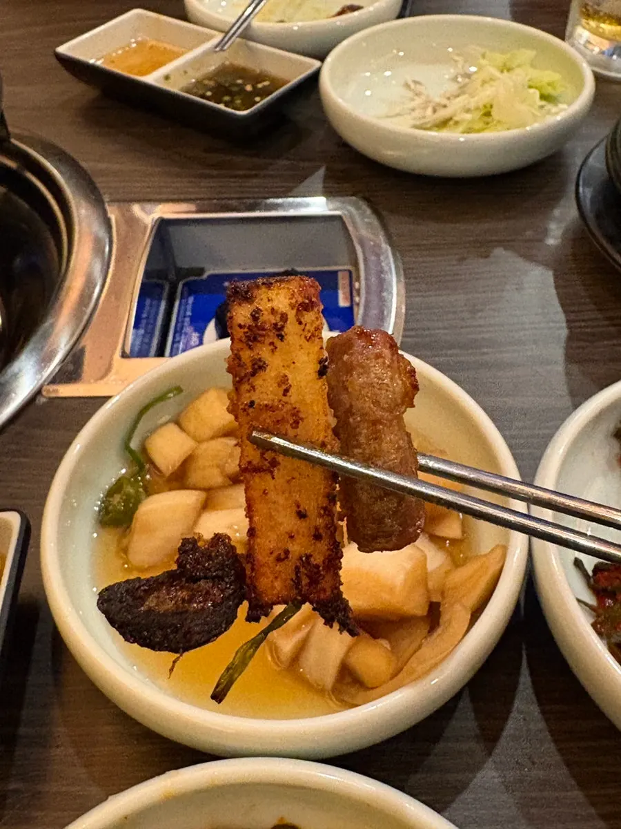 Assorted gopchang cooking with vegetables