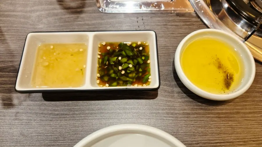 Side dish table with soy sauce and sesame oil dip