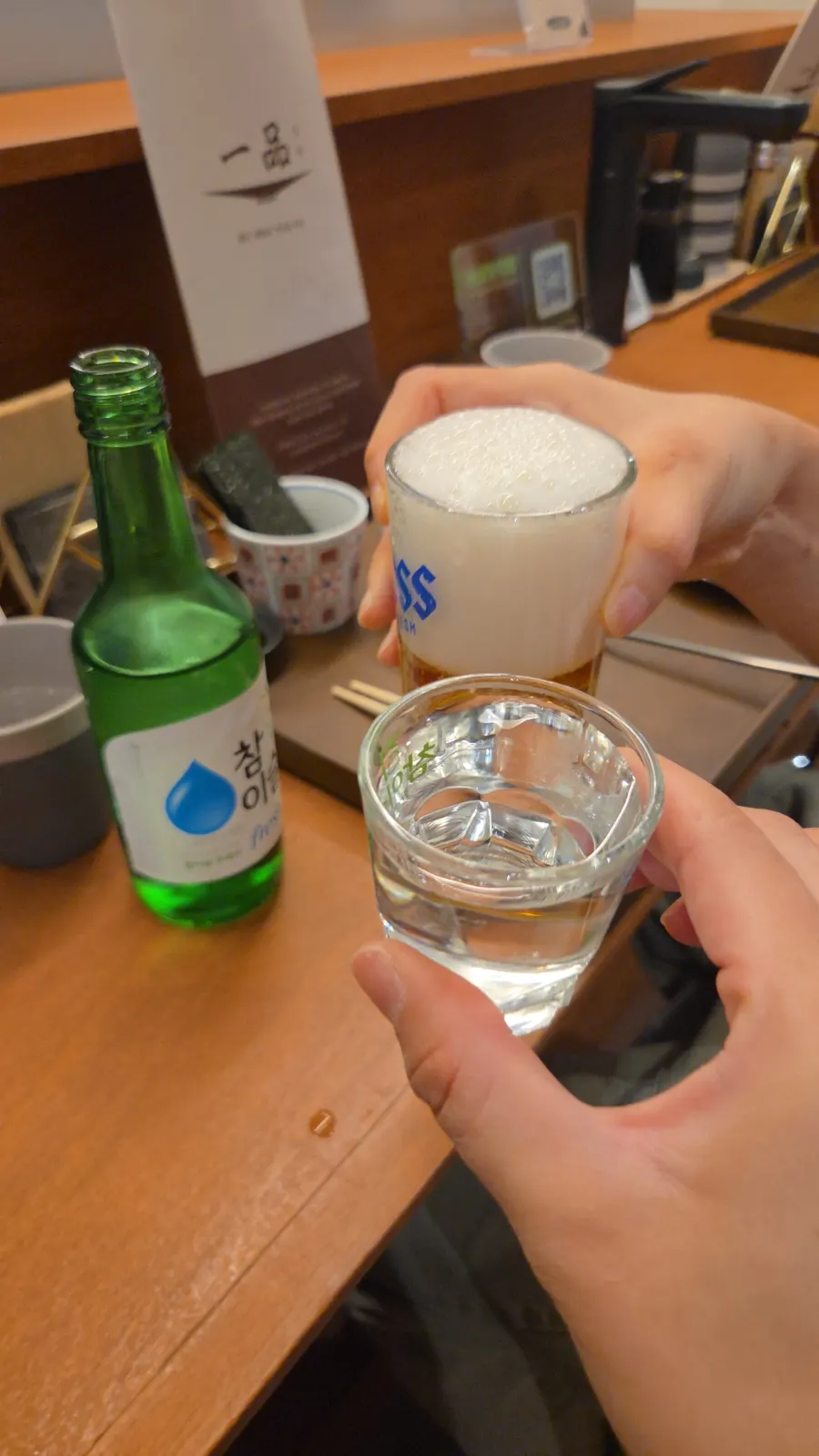 Cold beer and soju ordered before the food