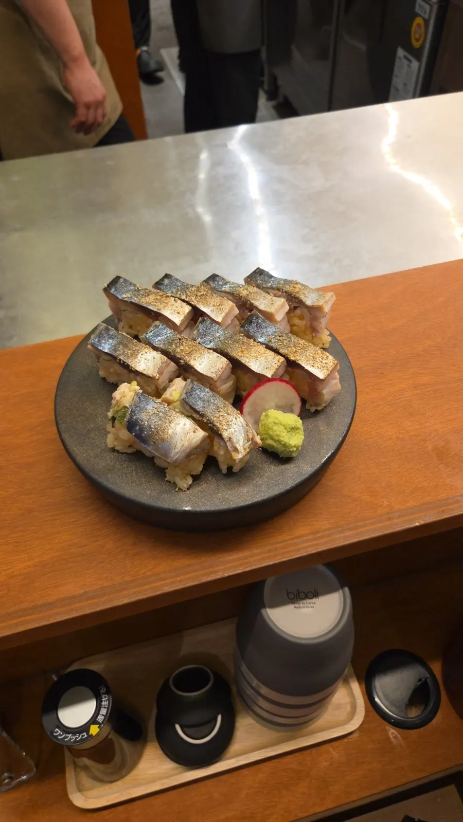 A spoonful of tuna and salmon roe scooped up together