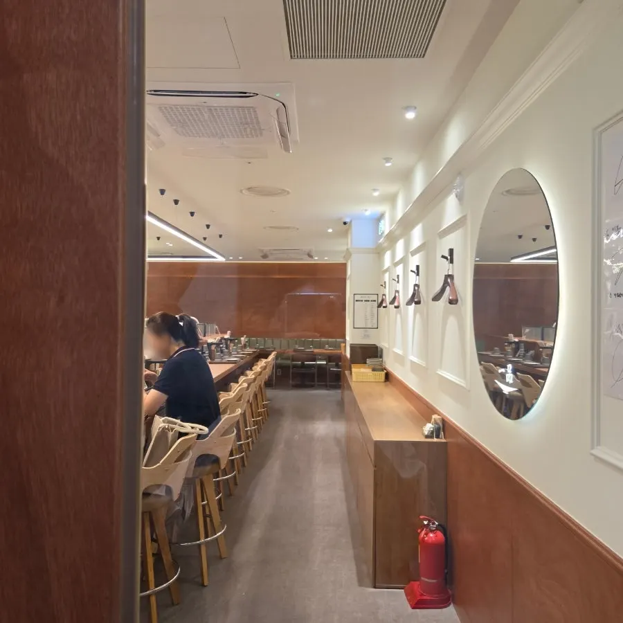 Interior of Ilpum Gangnam Branch with counter and table seats