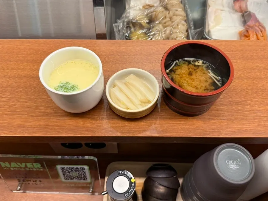 Basic table setting with chawanmushi, baek-kimchi, and miso soup
