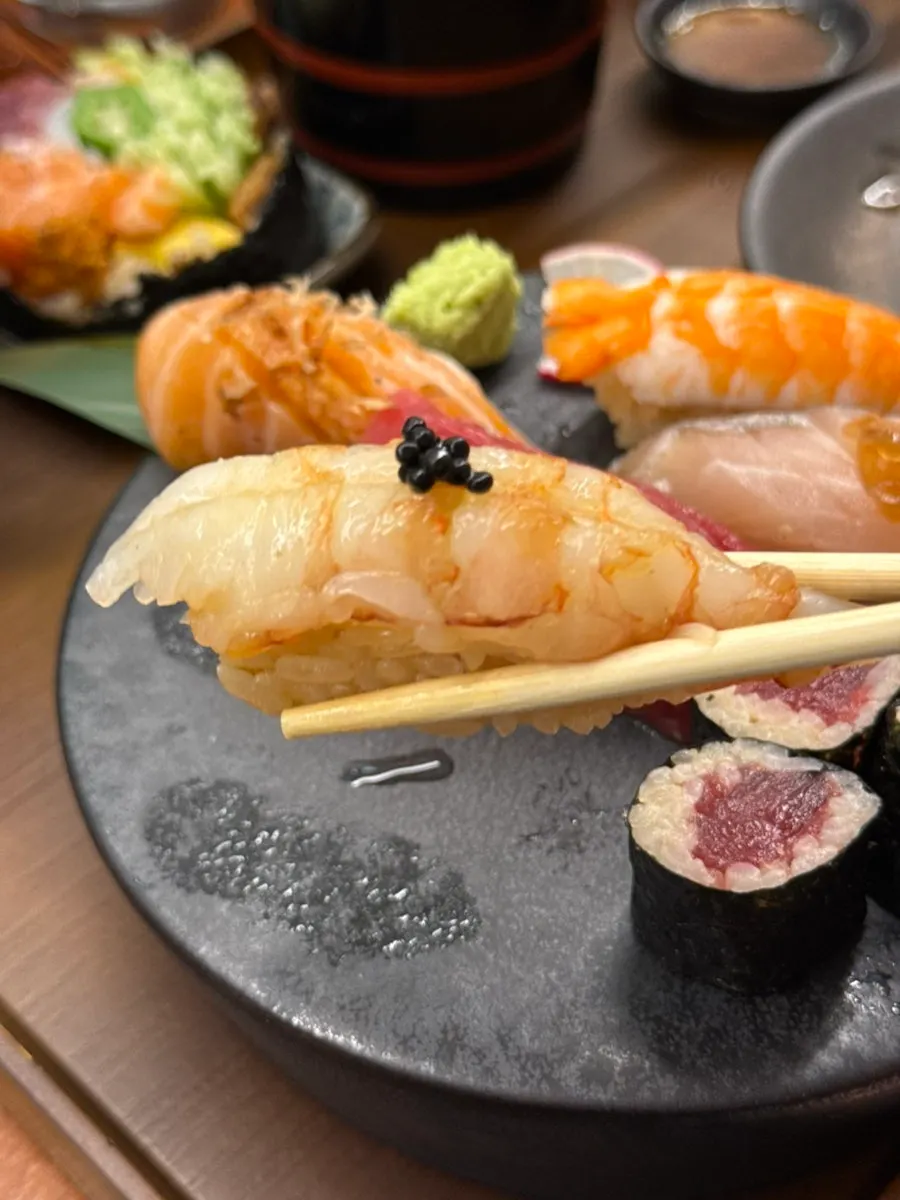 Raw shrimp sushi topped with caviar
