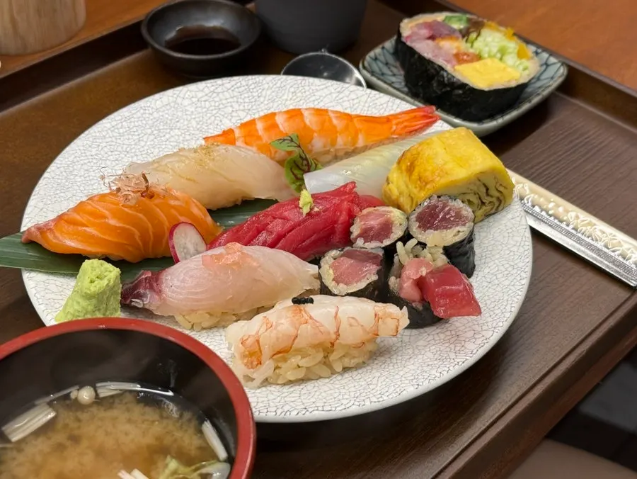 Sushi, futomaki, and cold udon served together