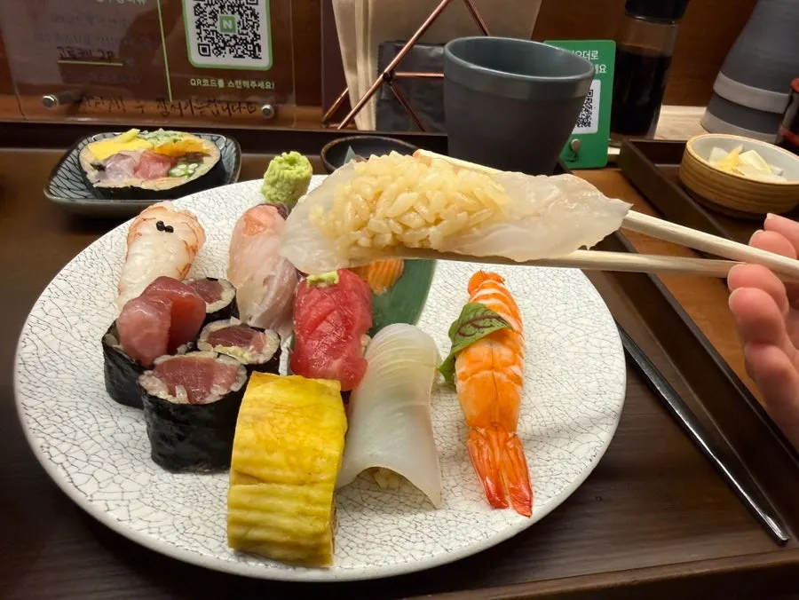An assortment of sushi in the today's sushi set