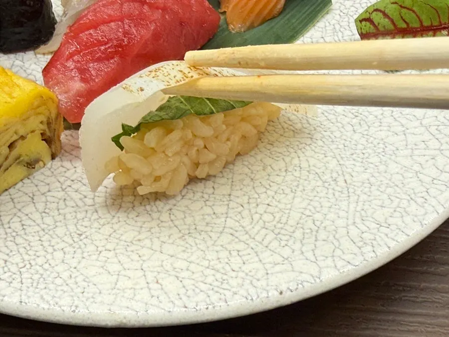 Close-up of a seasoned piece of sushi