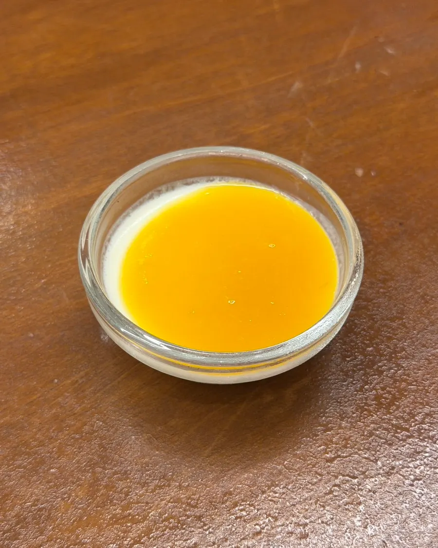 Mango sauce pannacotta served after the meal