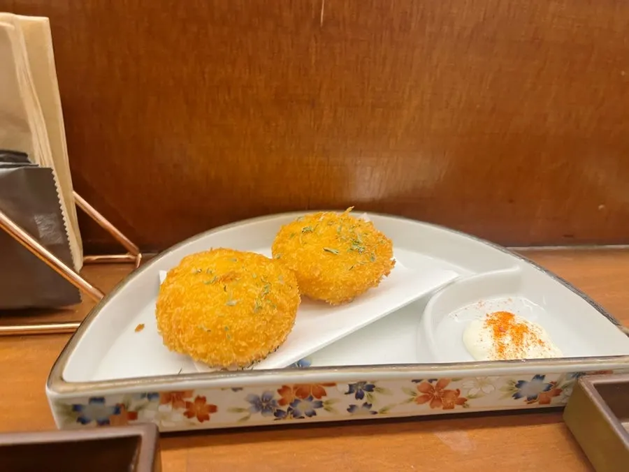 Crab croquette cut in half