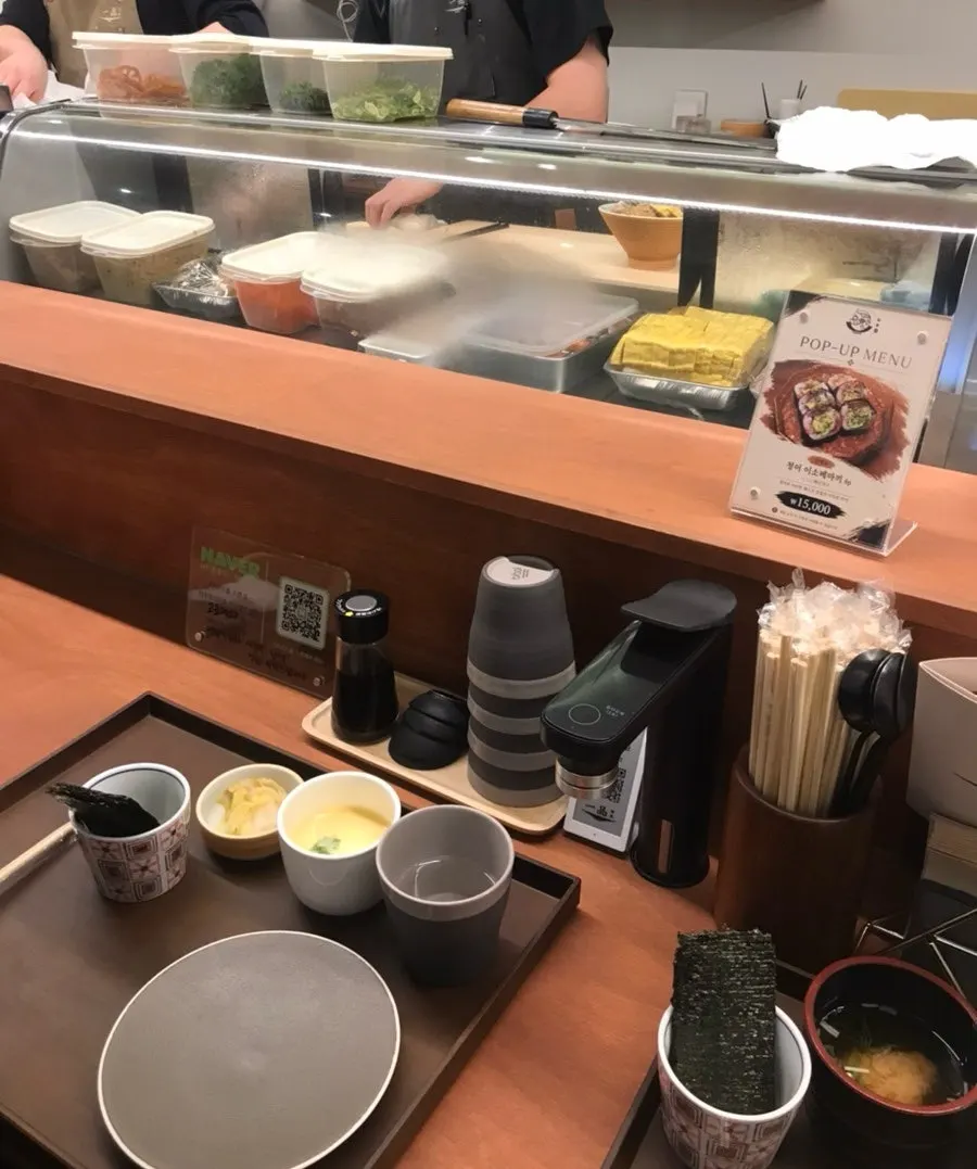 Steamed egg, miso soup, and baek-kimchi served as standard sides