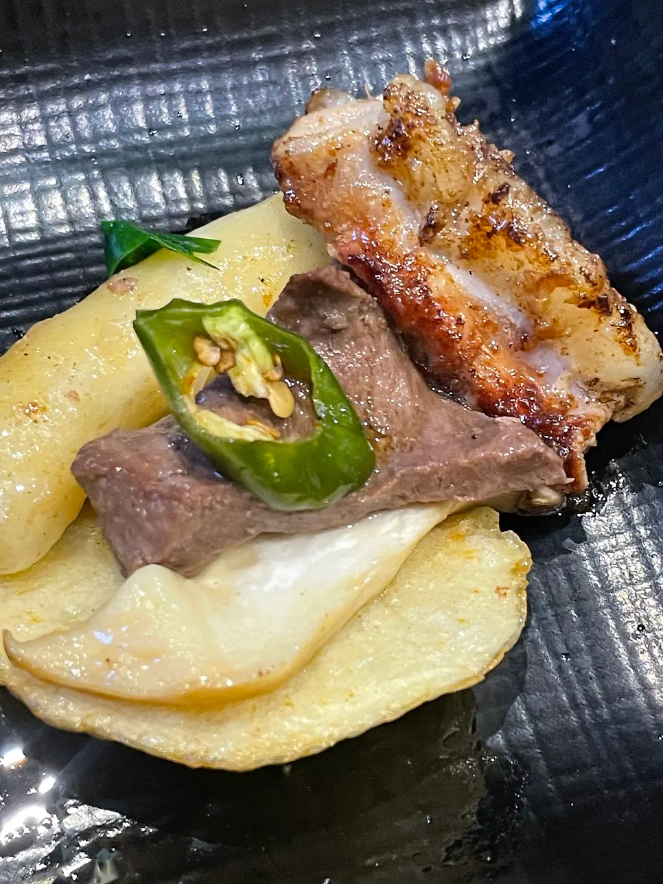 Golden, well-grilled gopchang with bean sprouts