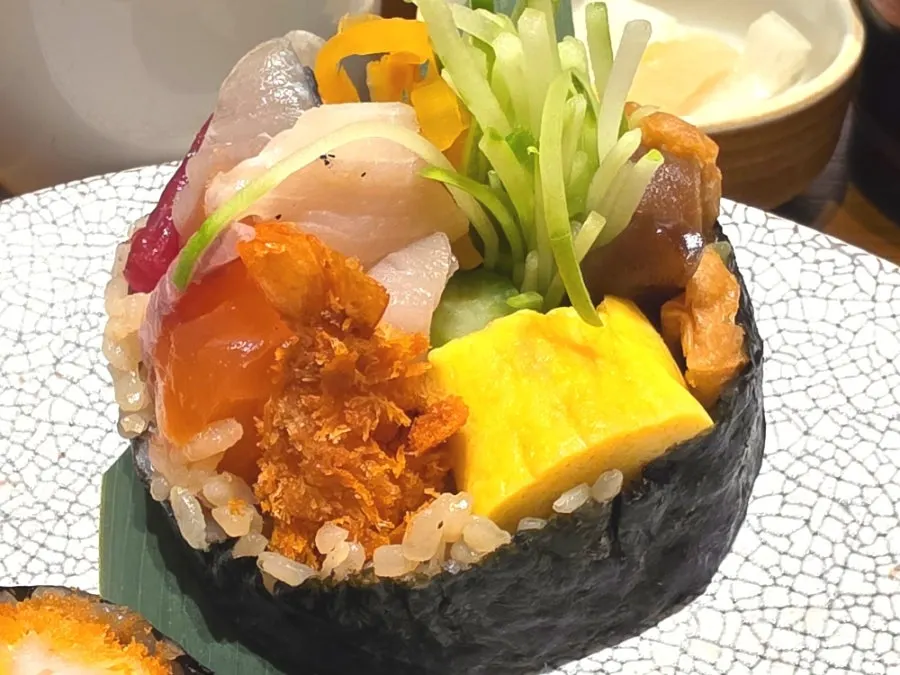 A roll of futomaki on a plate