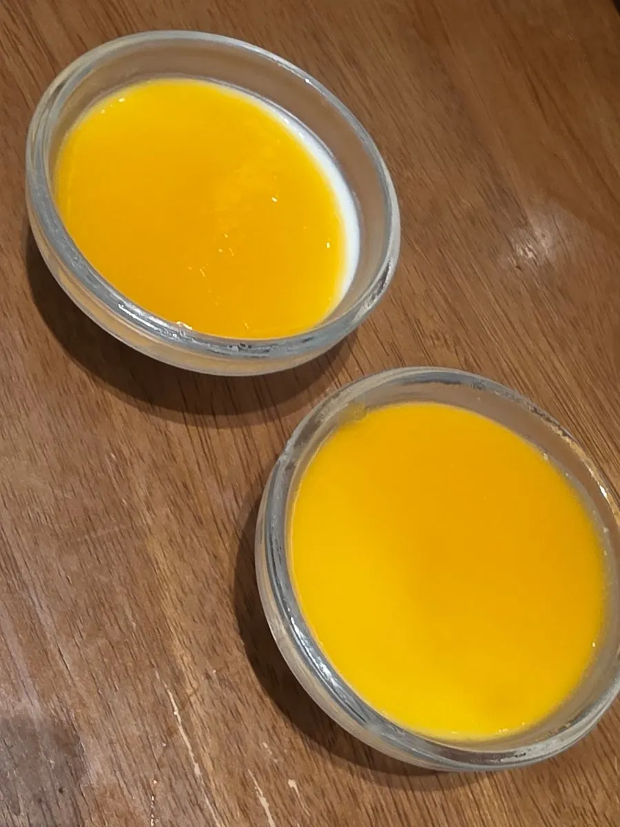 Post-meal dessert topped with mango sauce