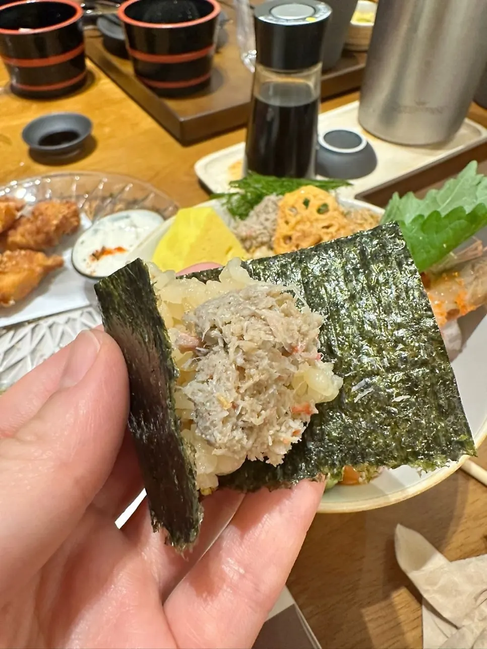 Wrapping sashimi and wasabi in gamtae seaweed
