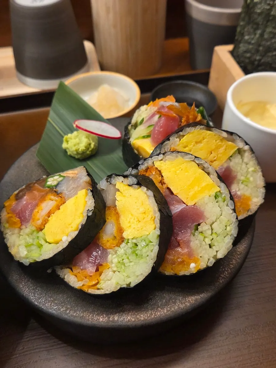 Lifting up a piece of futomaki