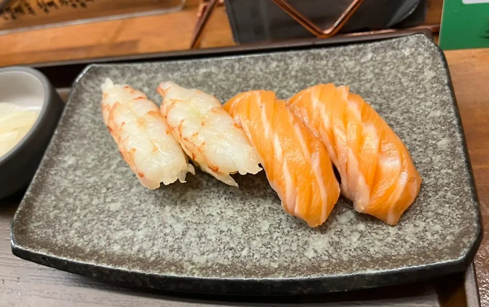 Salmon and shrimp sushi added as extras