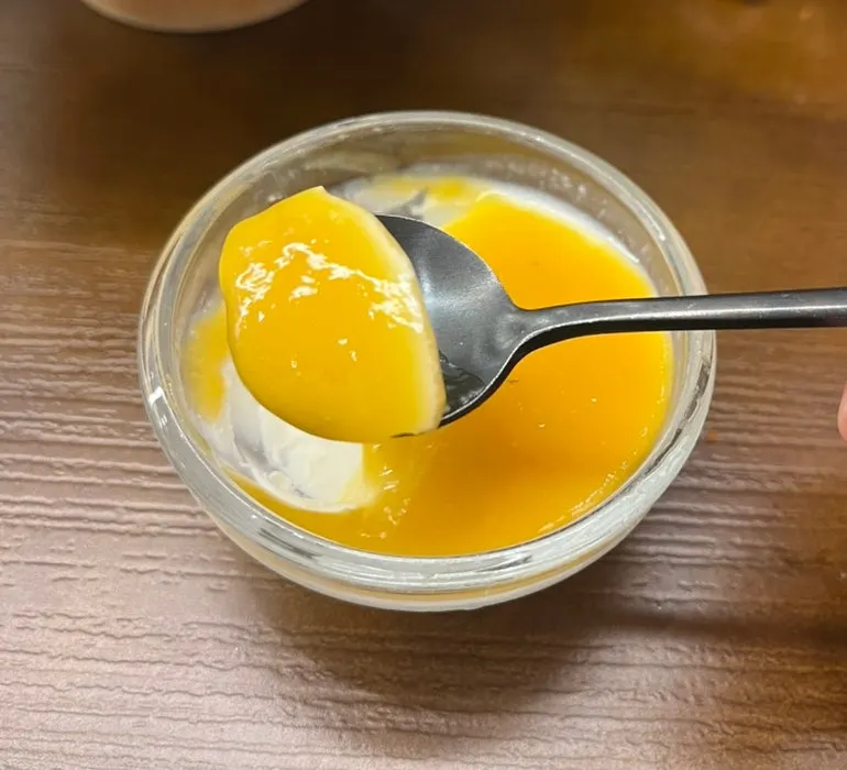 Milk pudding topped with mango