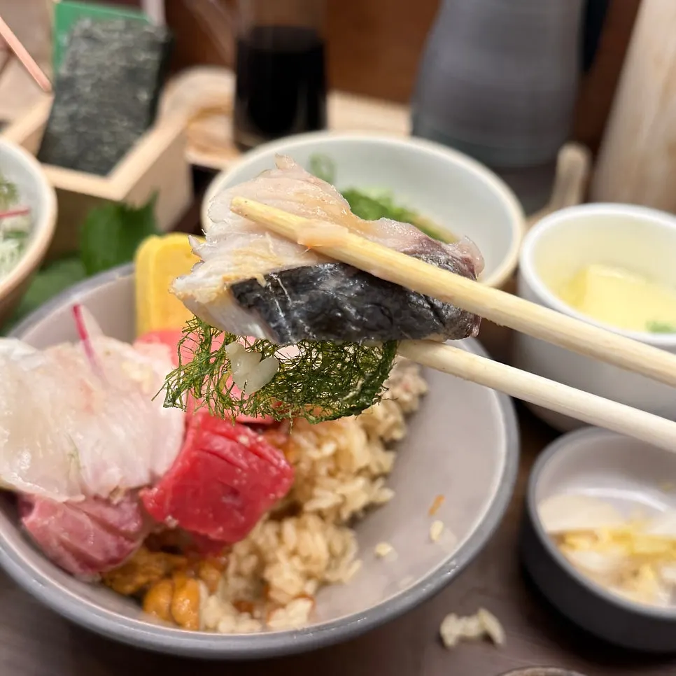 Thick sashimi dipped in soy sauce