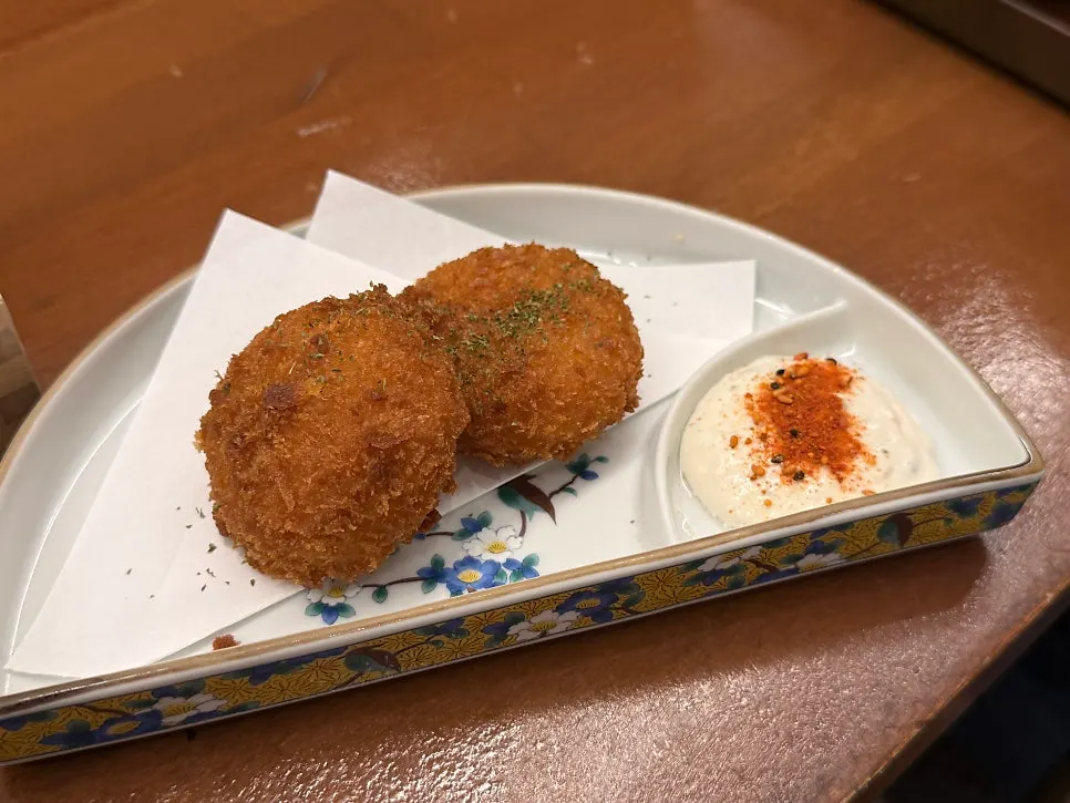 Cross-section of a croquette with filling spilling out