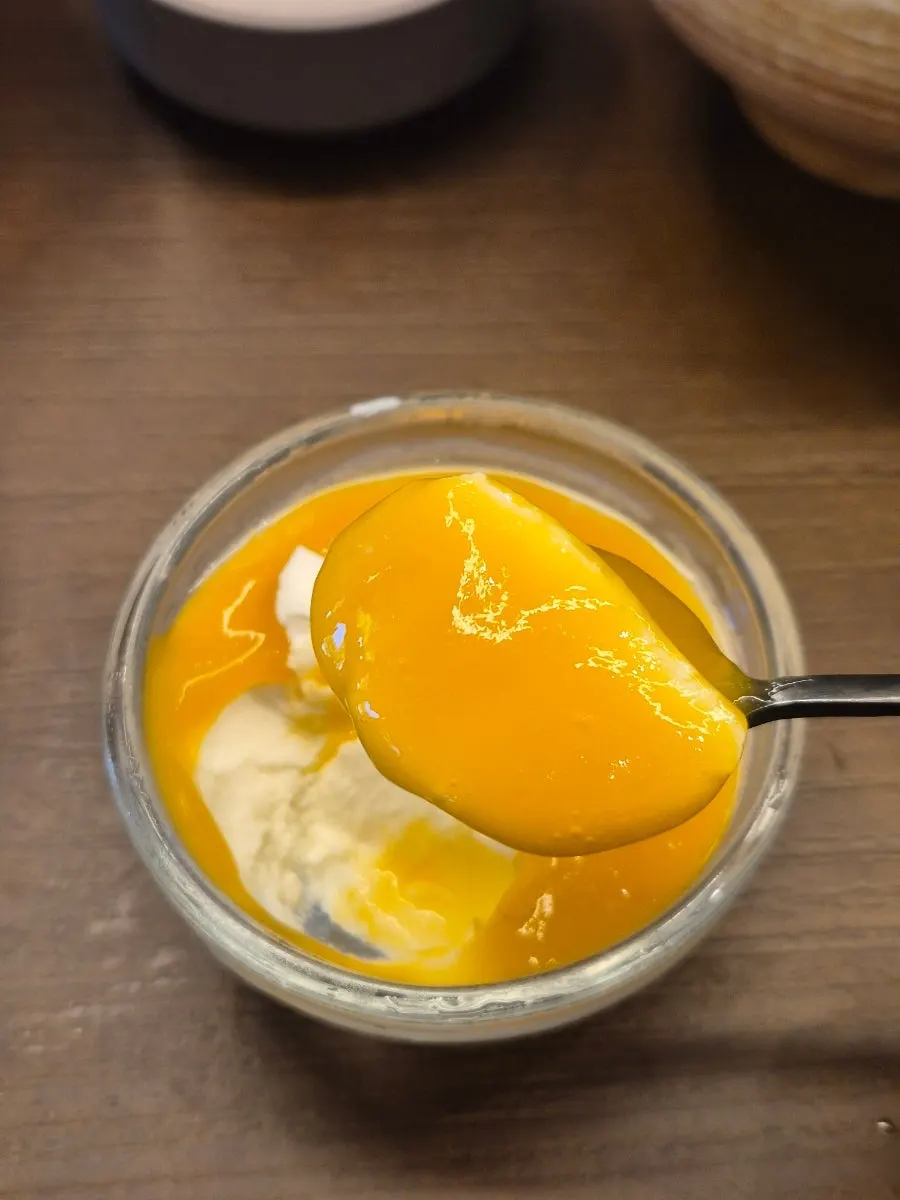 A spoonful of mango puree pannacotta