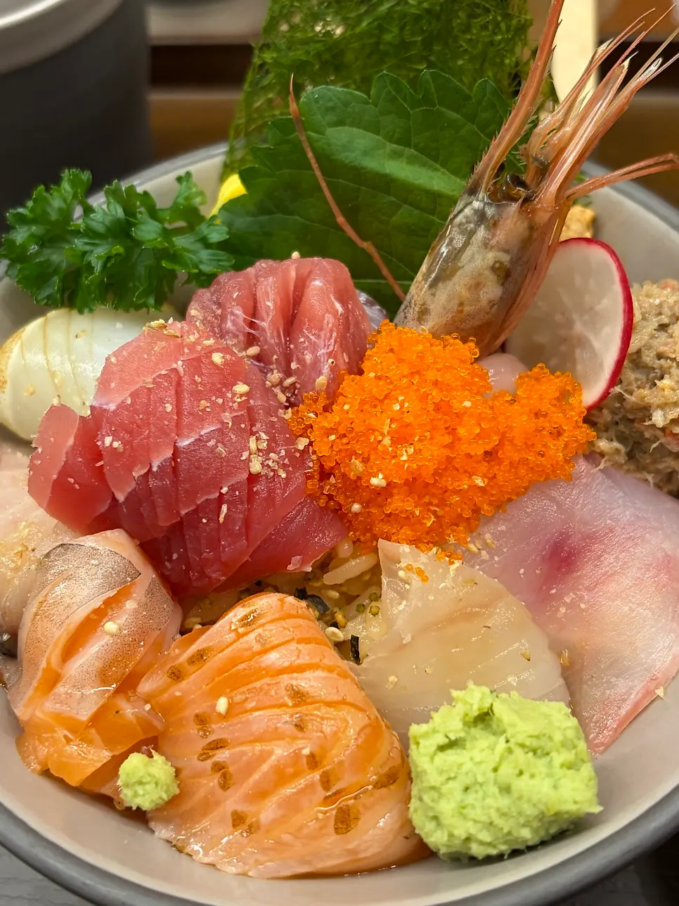 Close-up of kaisendon topped with tuna and seared scallop