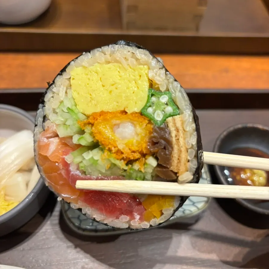 A plate of sushi topped with aged sashimi