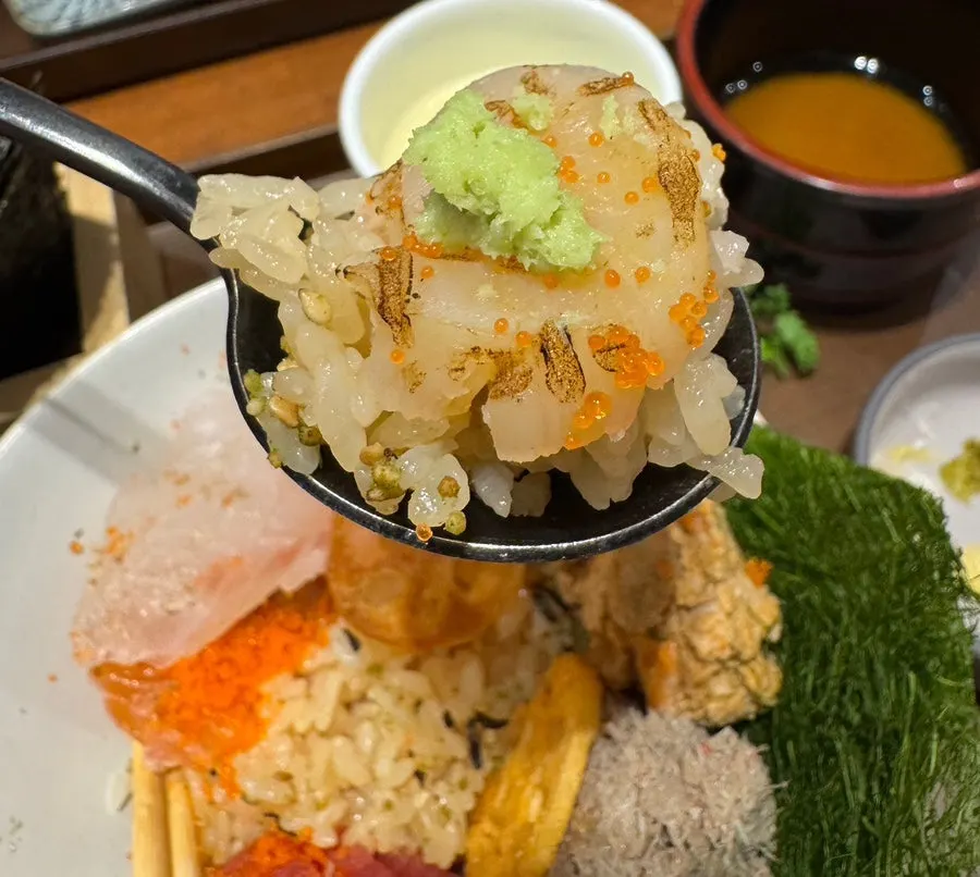 A spoonful of kaisendon with rice