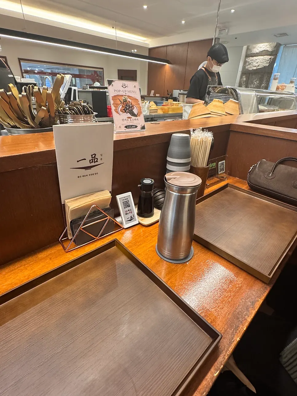 View of the kitchen from the bar seats