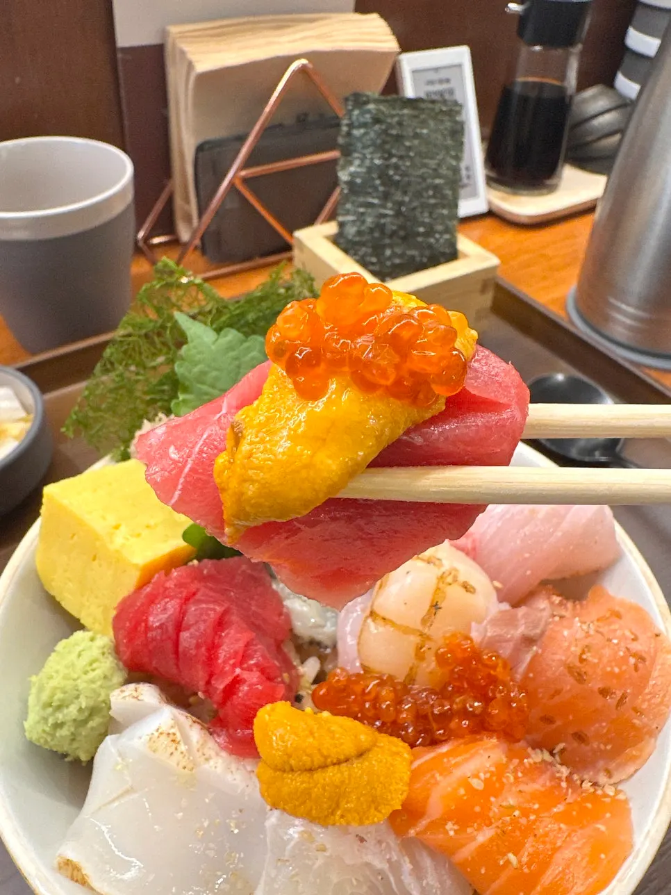 A bite of shari and neta on nori