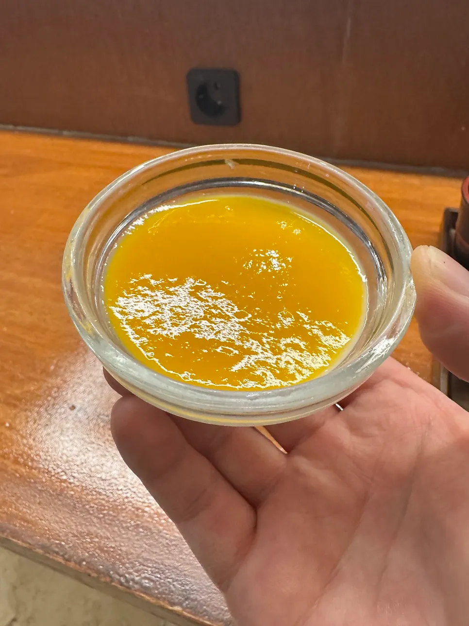 Milk pudding topped with mango purée
