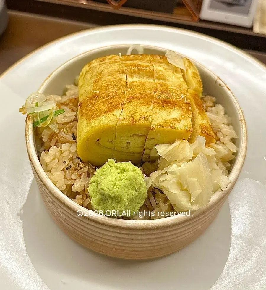 Eel cut into bite-sized pieces on a plate