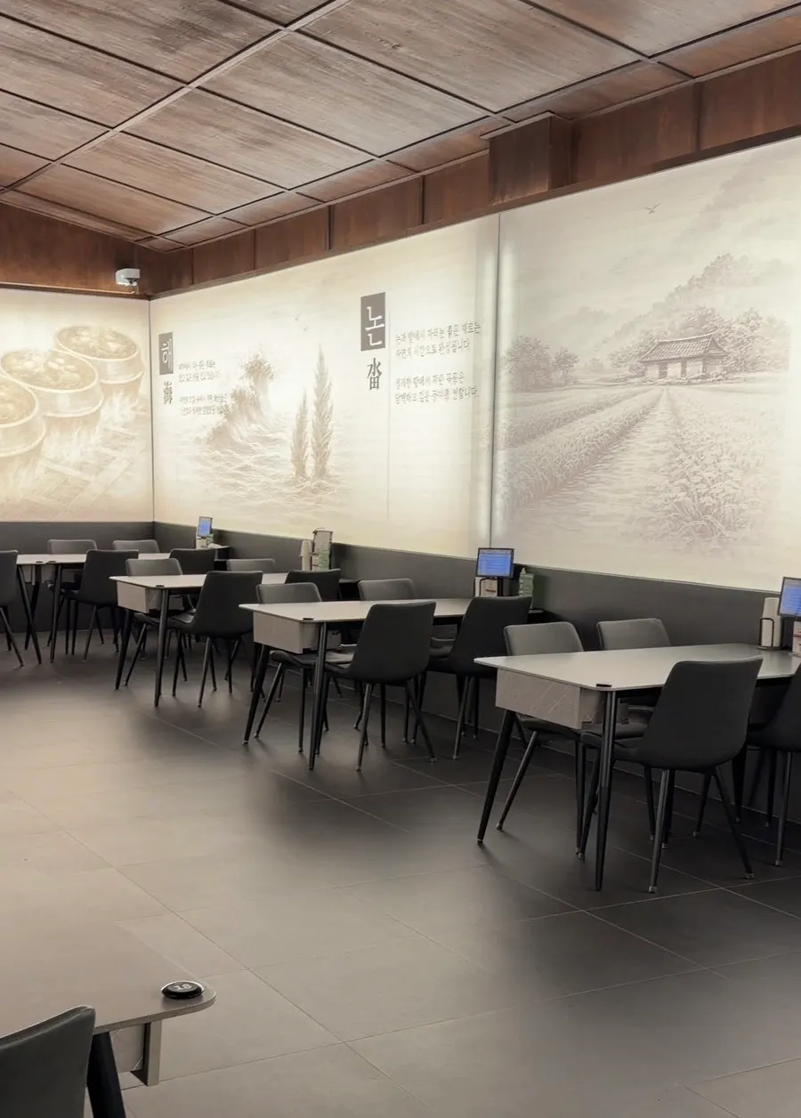 Restaurant interior with an ink-wash-style mural