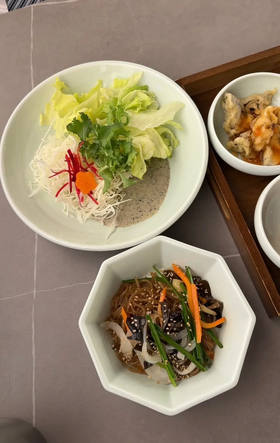 Full table spread with salad and side dishes