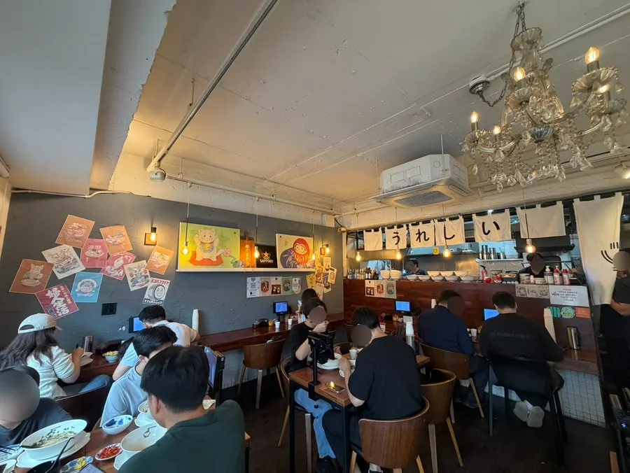 Interior of Gyedan Ramen with bar seats and 4-tops