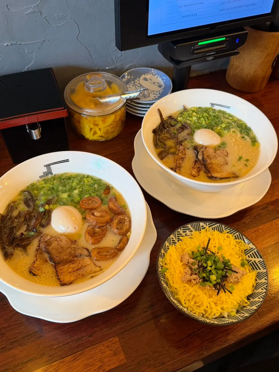 Gyedan ramen, motsu ramen, and tamago-bap set on the table