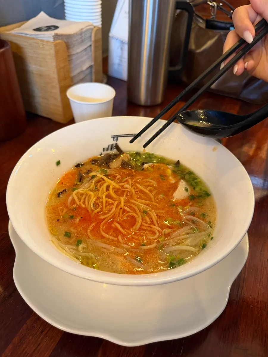 Noodles lifted out of the ramen broth