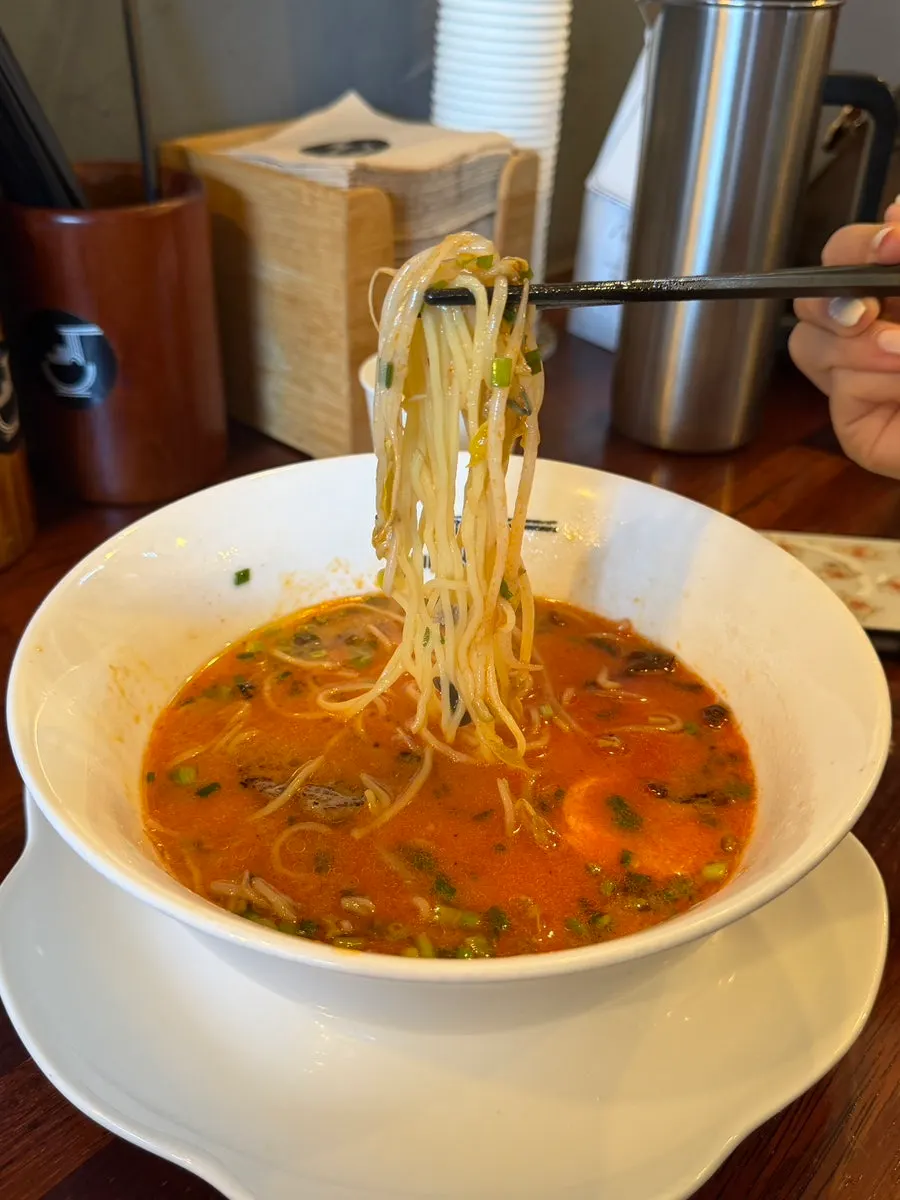 Ramen broth with spicy secret sauce added